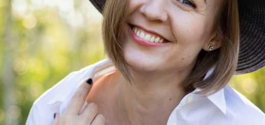 a woman wearing a hat and a white shirt